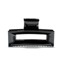 Frame 9 claw clip in Piano Black — architectural jet-black cellulose acetate hair clip, made in France