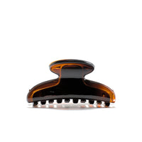 Luna 6 claw clip in Deep Amber — small tortoise-tone cellulose acetate hair clip, made in France