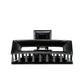 Frame 9 Piano Black claw clip detail — Meera Studio Line, polished black finish
