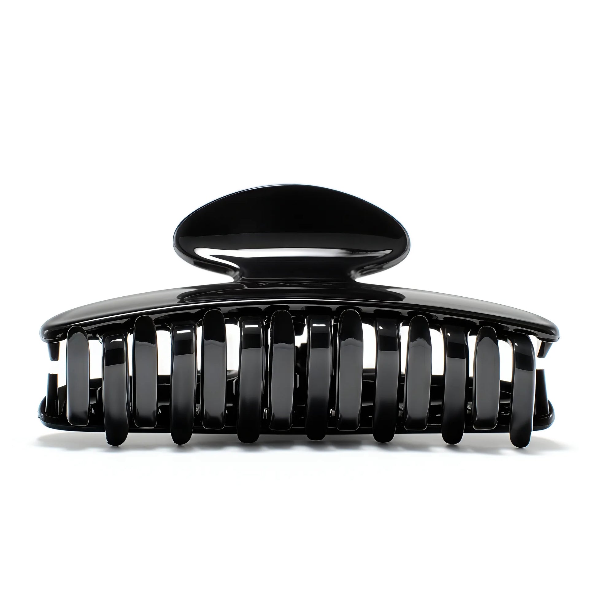 Luna 9 Piano Black claw clip detail — Meera Studio Line, polished black silhouette