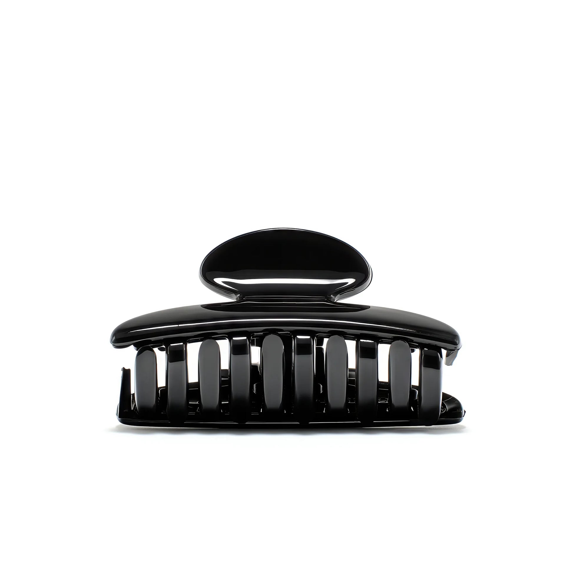 Luna 6 Piano Black claw clip detail — Meera Studio Line, polished black silhouette