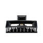 Frame 9 Piano Black claw clip detail — Meera Studio Line, polished black finish