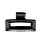 Frame 9 claw clip in Piano Black — architectural jet-black cellulose acetate hair clip, made in France