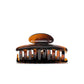 Luna 6 Deep Amber claw clip detail — Meera Studio Line, rounded tortoise silhouette