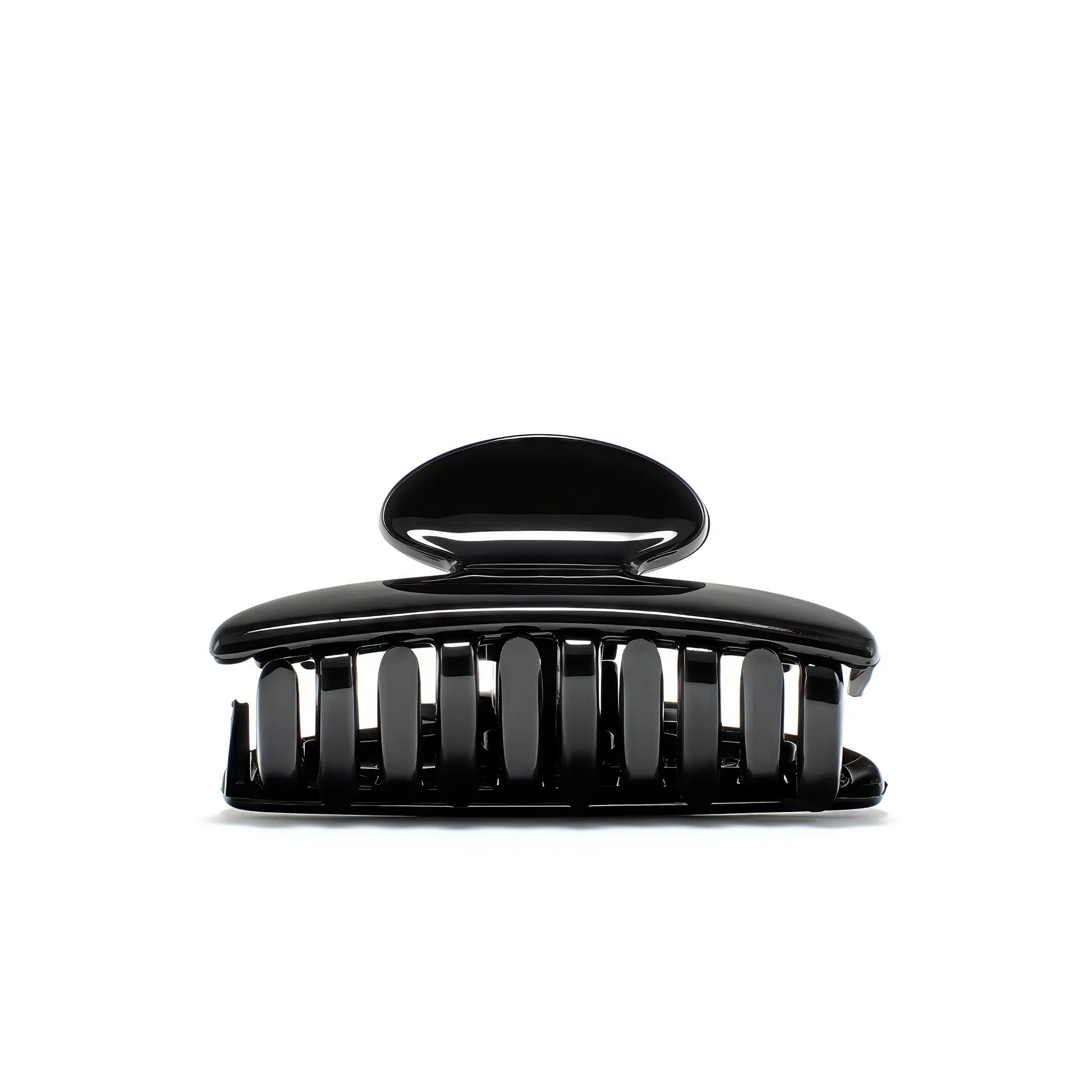 Luna 6 Piano Black claw clip detail — Meera Studio Line, polished black silhouette