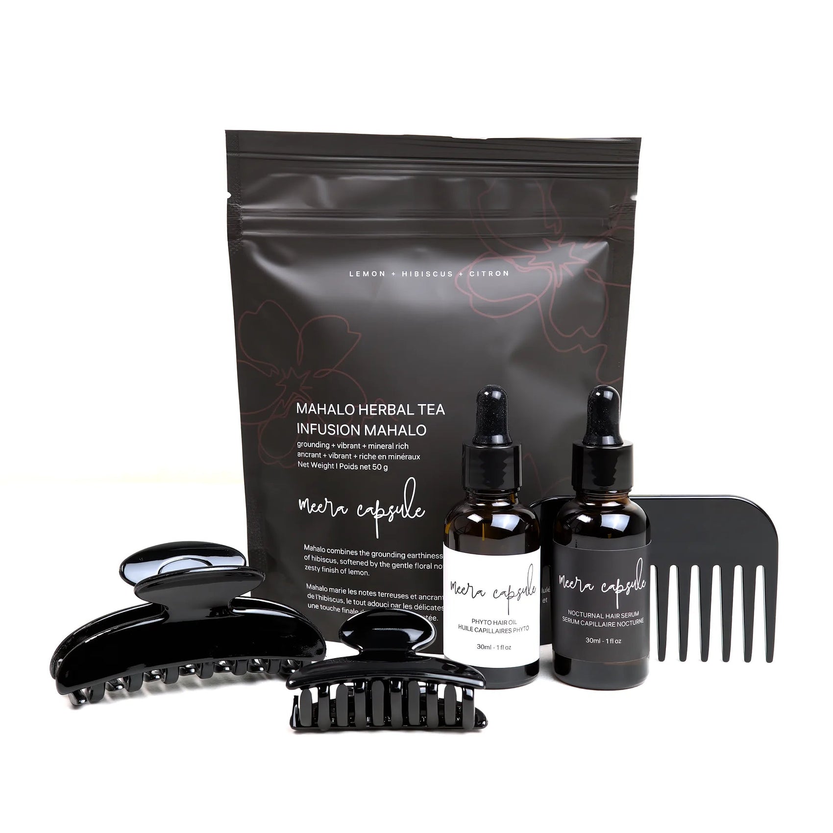 Luna Nourish Capsule in Piano Black — Meera evening ritual bundle with Luna jet-black clip, Phyto Oil, Nocturnal Serum, and Mahalo Tea
