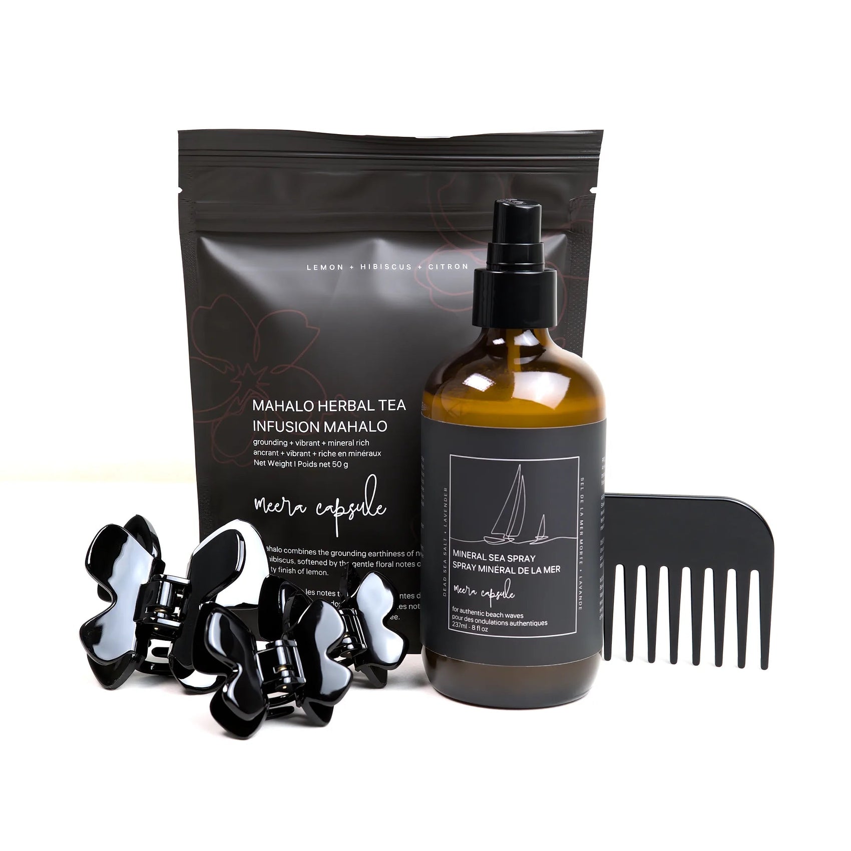 Phoebe Beach Capsule in Piano Black — Meera summer bundle with Phoebe jet-black clips, Mineral Sea Spray, and Mahalo Herbal Tea