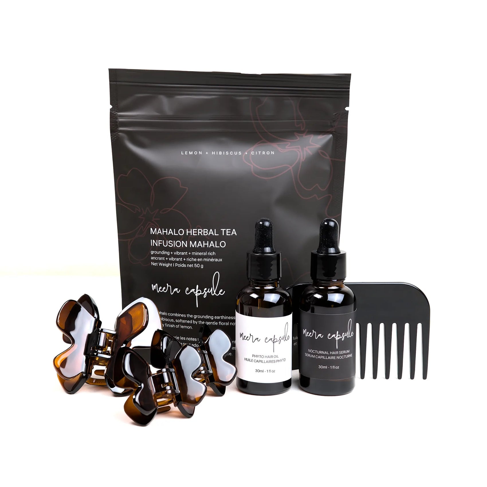 Phoebe Nourish Capsule in Deep Amber — Meera evening ritual bundle with Phoebe tortoise clip, Phyto Oil, Nocturnal Serum, and Mahalo Tea