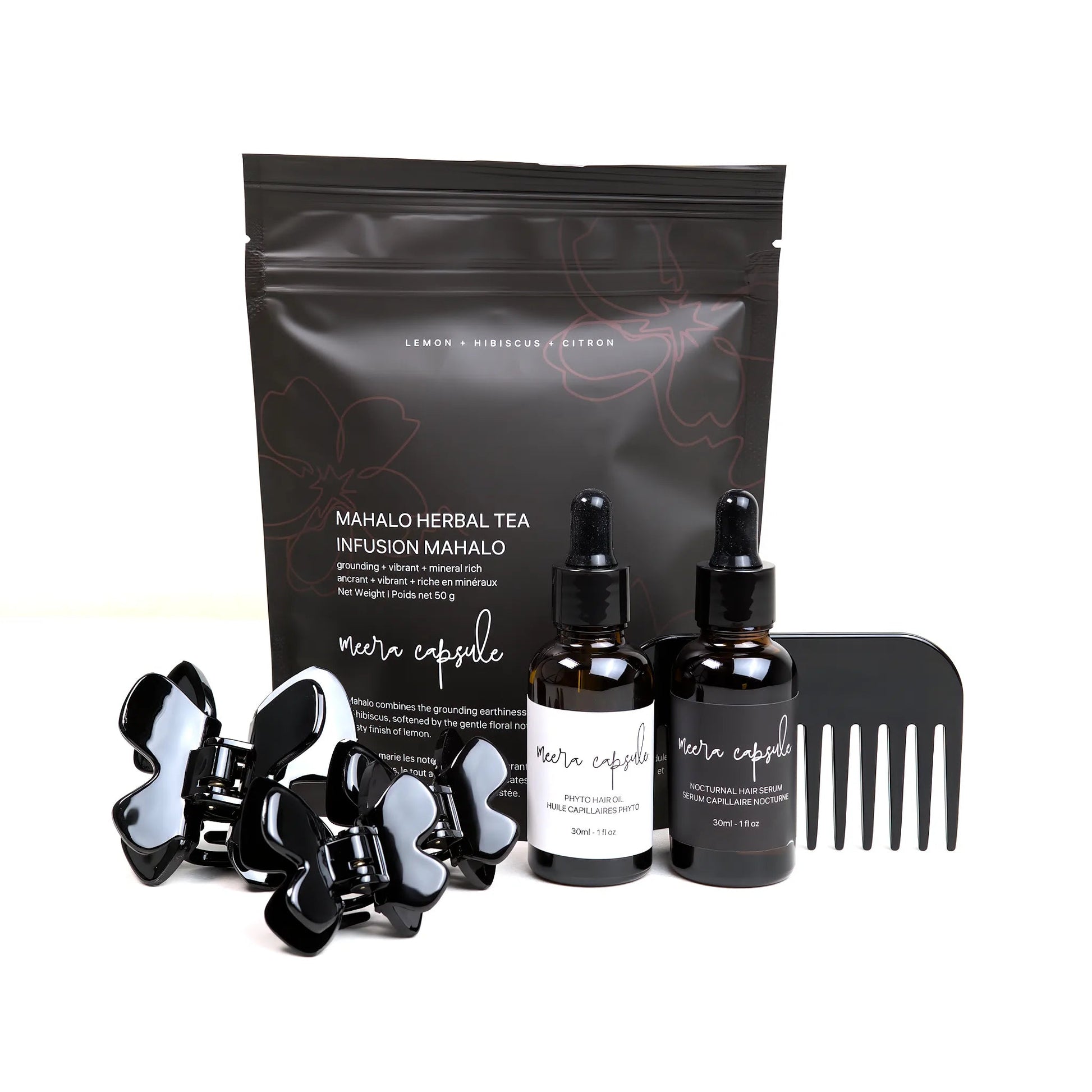 Phoebe Nourish Capsule in Piano Black — Meera evening ritual bundle with Phoebe jet-black clip, Phyto Oil, Nocturnal Serum, and Mahalo Tea