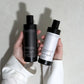 Meera Capsule Shampoo + Conditioner Bundle close-up — amber glass bottles with minimalist labels on neutral background